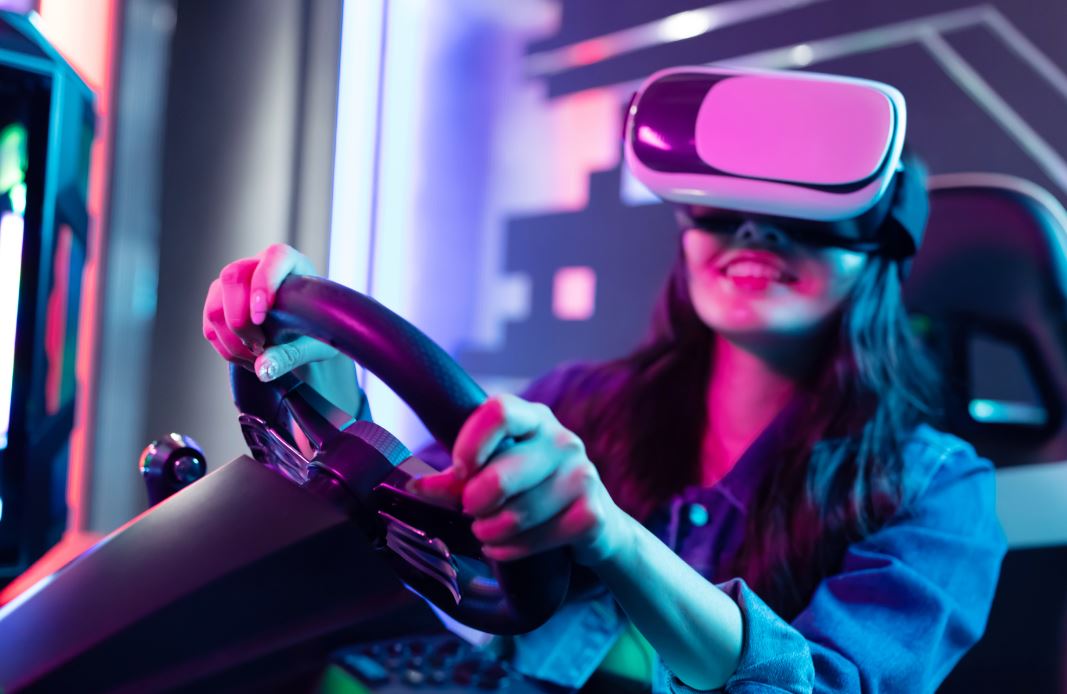 asian woman wears vr glasses and play car racing online video games