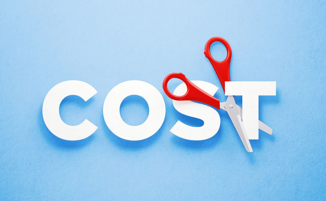 Red scissors cutting the word cost over blue background. Horizontal composition with copy space