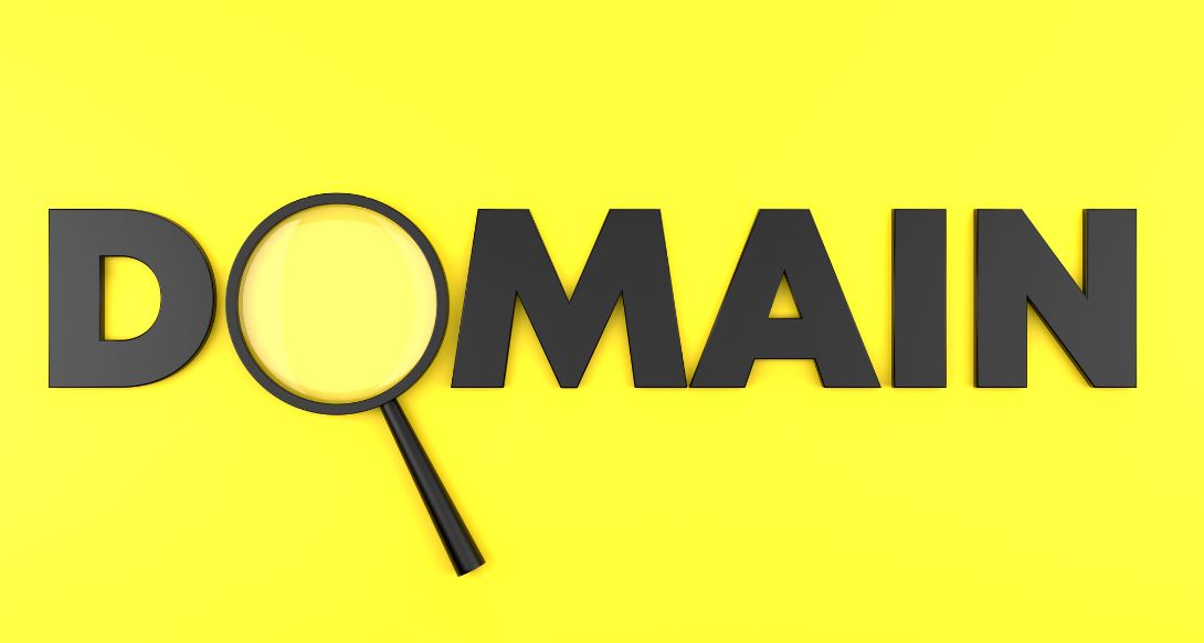 ooking at the DOMAIN text on yellow background with a magnifying glass.
 Business Research Concept.